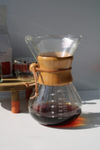 Chemex coffee maker wrapped in a towel to keep it warm 1